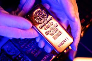 Gold gains as oil, dollar retreat; investors brace for US inflation test